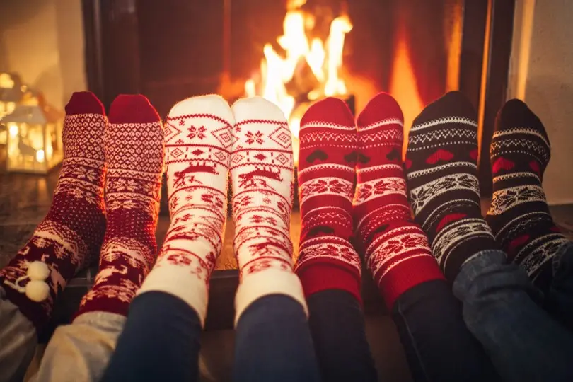 Stocking feet in front of fireplace Stocking feet in front of fireplace